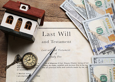 Probate concept image with a will, and house model, showcasing estate administration